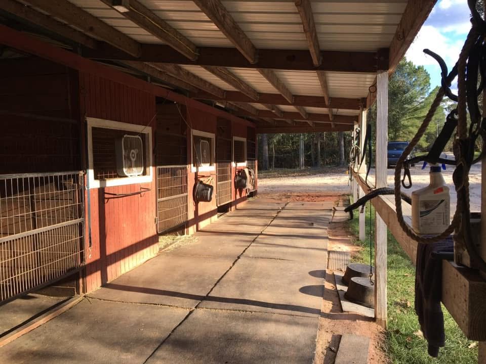 A barn aisle at Merry Go Round Farm